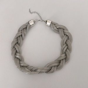 Braided statement necklace in silver colour. Stylish and versatile🤍